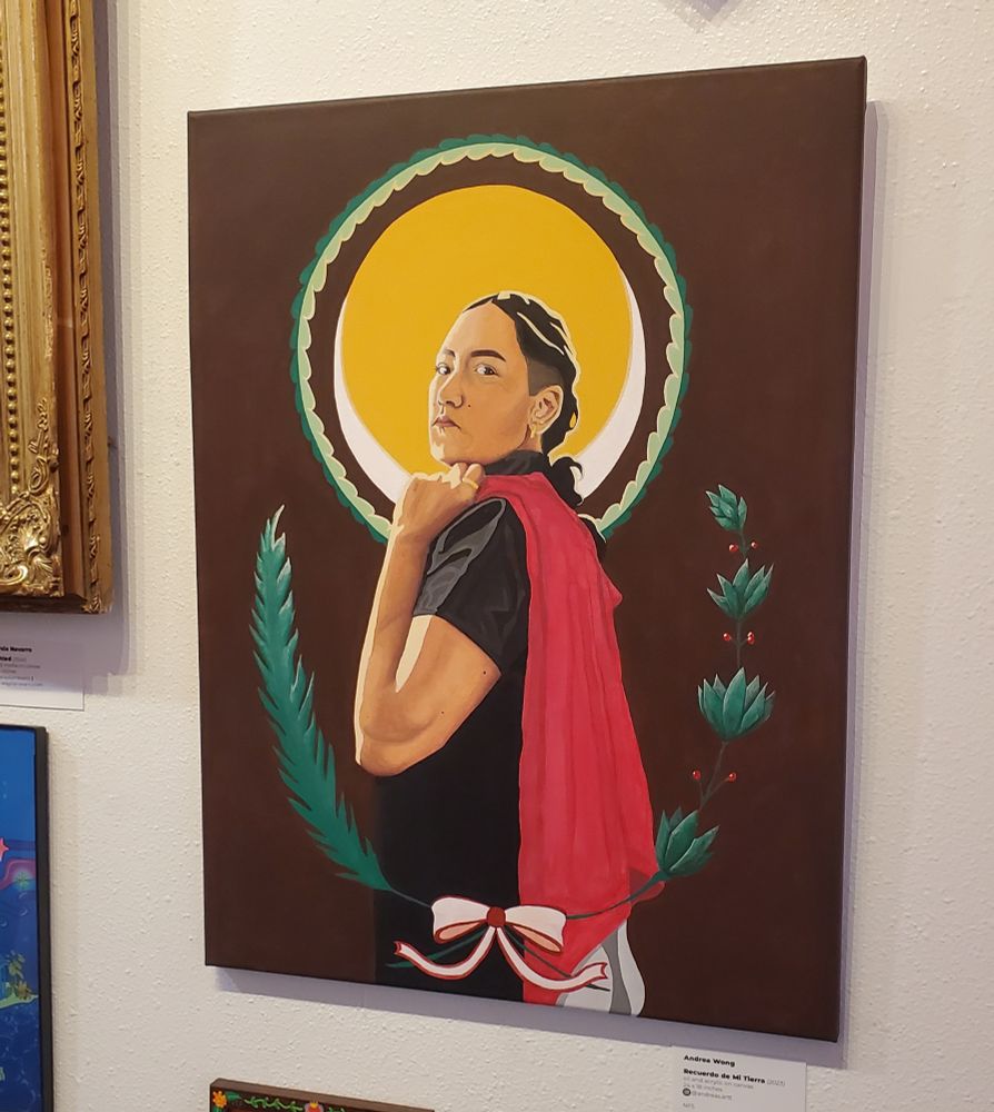 acrylic and oil self portrait showing a woman looking over her shoulder, with her arm bent upward holding a flag that drapes over her back. She is framed by greenery and a bright circle behind her head.