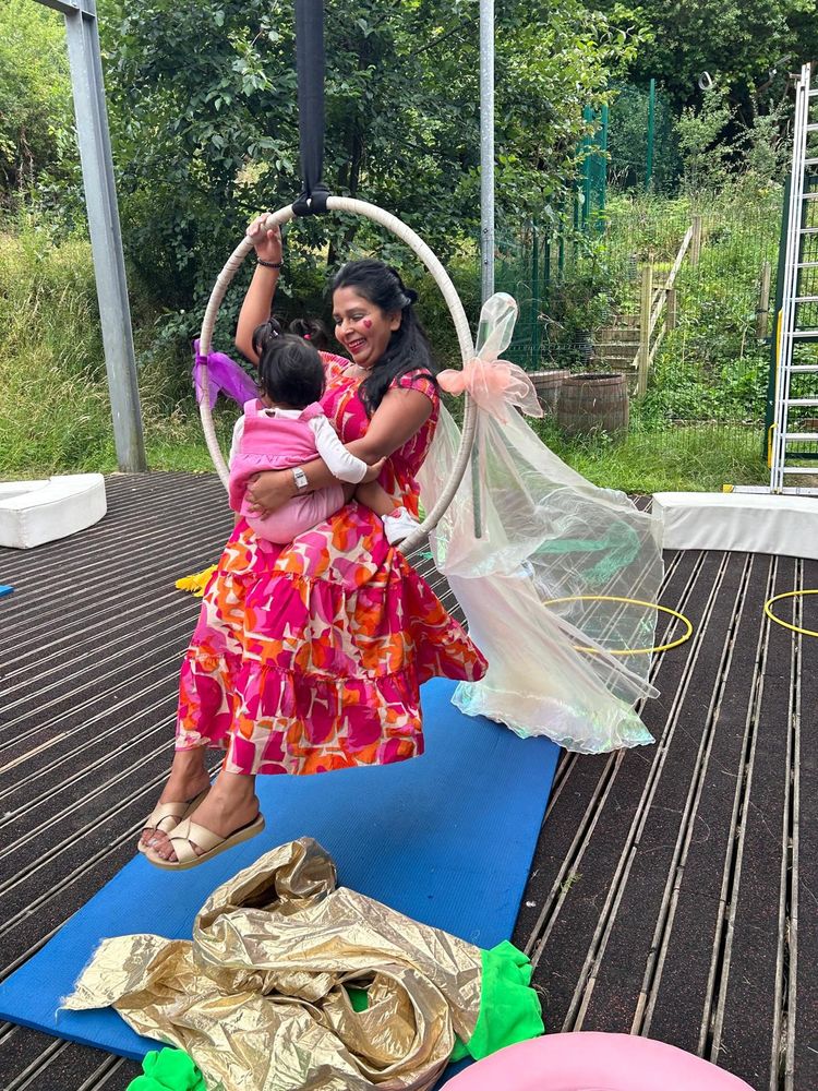Mother and her child swinging on a trapeze