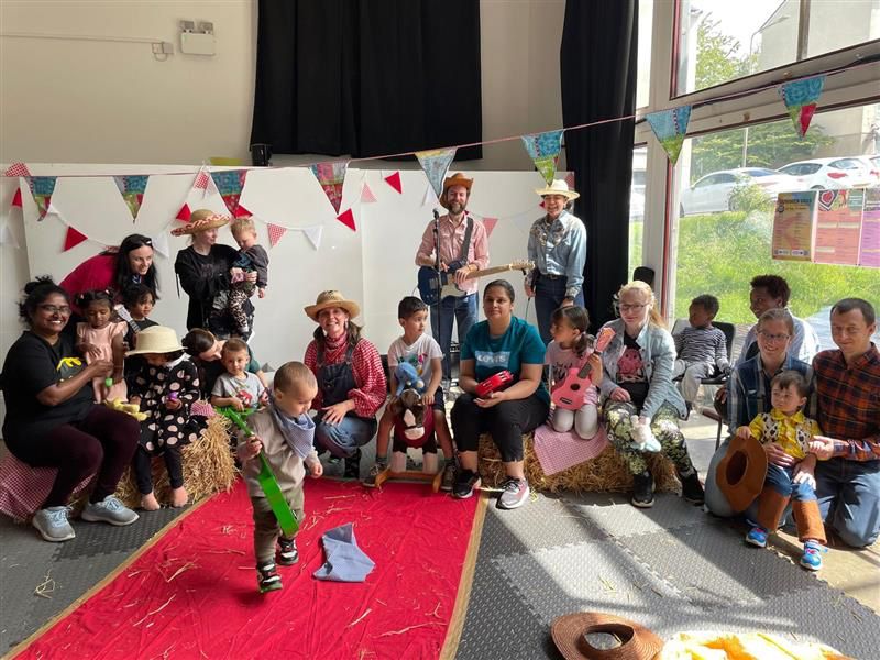 A group photo of Starcatchers Saturdays families and artists during the final hoedown session 