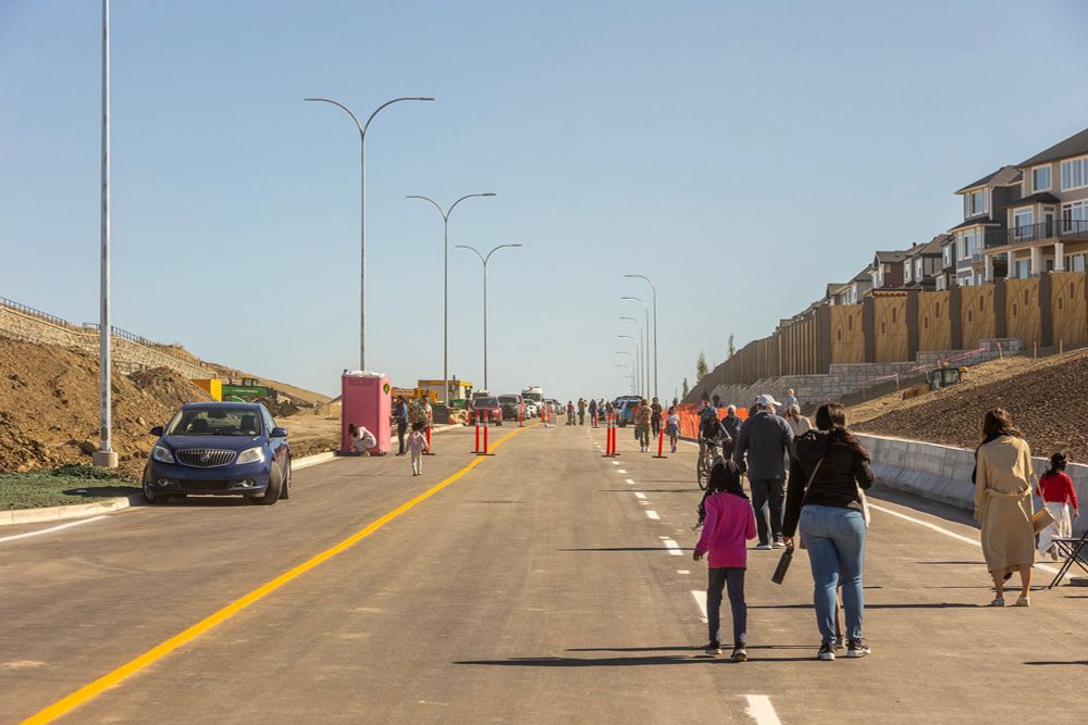 144 Avenue NW opening connects east and west Calgary north of Stoney Trail