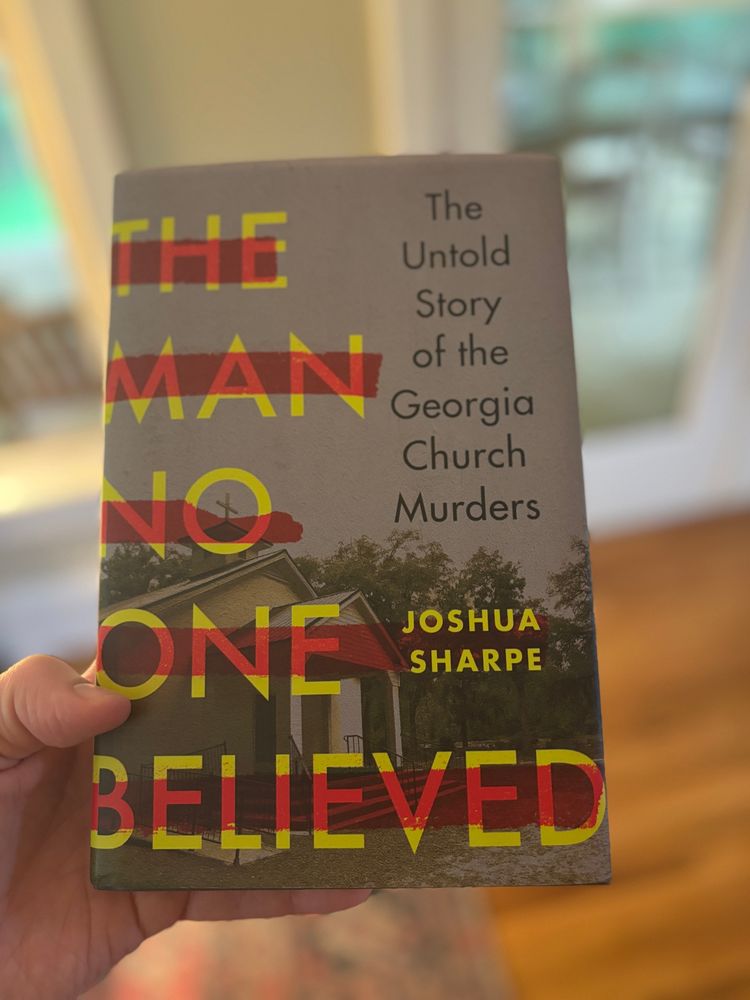 Me holding a book “The Man No One Believed” by my friend Josh Sharpe.
