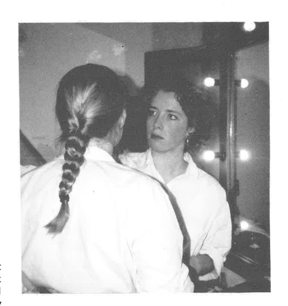 Me age 17 putting makeup on someone before a drama performance 