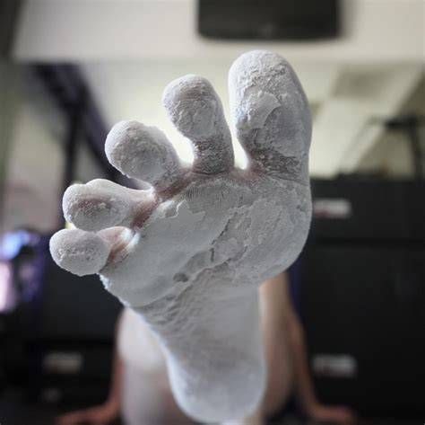 Foot covered in chalk.