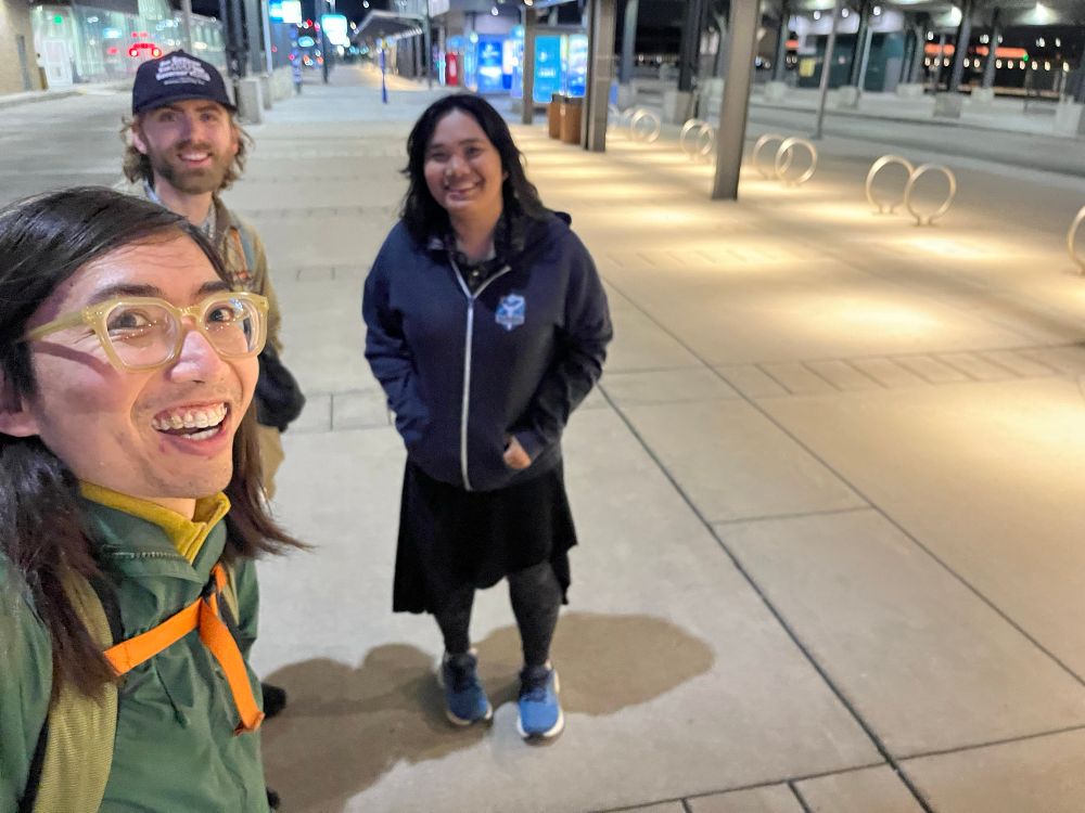 Three people at Union Depot bus bays