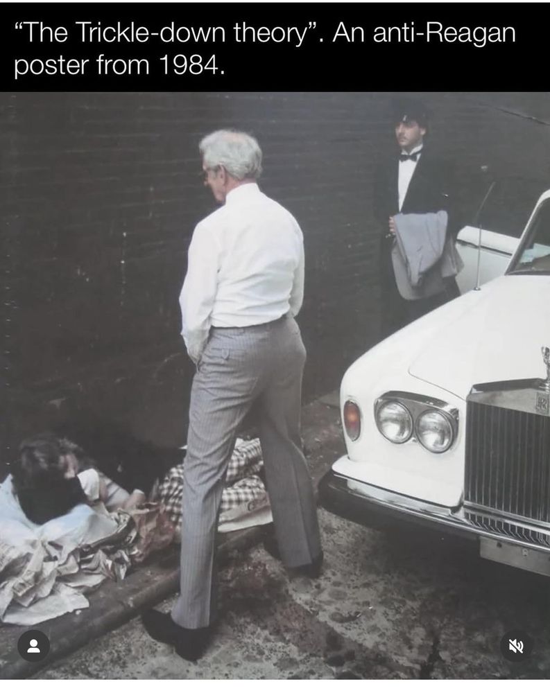 A satirical 1984 poster titled "The Trickle-down theory" criticizes Reagan-era economic policies. It shows a wealthy older man in a white shirt and striped trousers urinating on a homeless person lying in a blanket on the street. A Rolls-Royce and a man in a tuxedo stand nearby, highlighting the stark contrast between wealth and poverty.