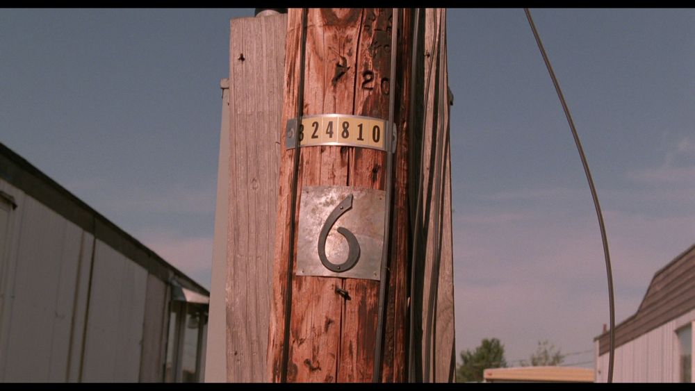 An electric pole in a trailer park