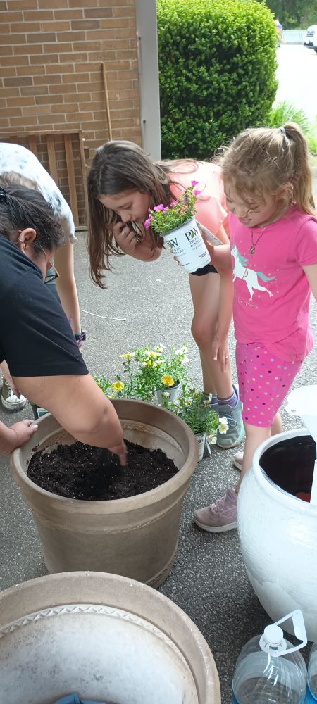 Volunteers planting at St. Agatha's in Woonsocket.