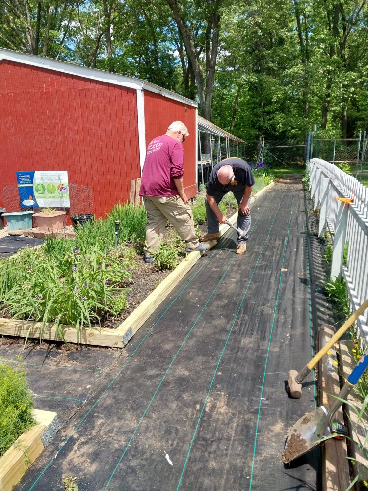 Volunteers adding flower beds at Daggett Farm, Slater Park, Providence.