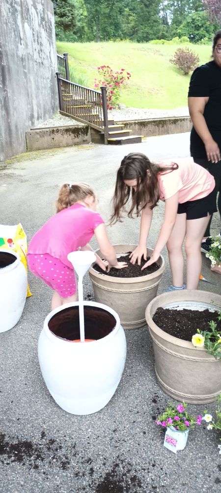 Volunteers planting at St. Agatha's in Woonsocket.