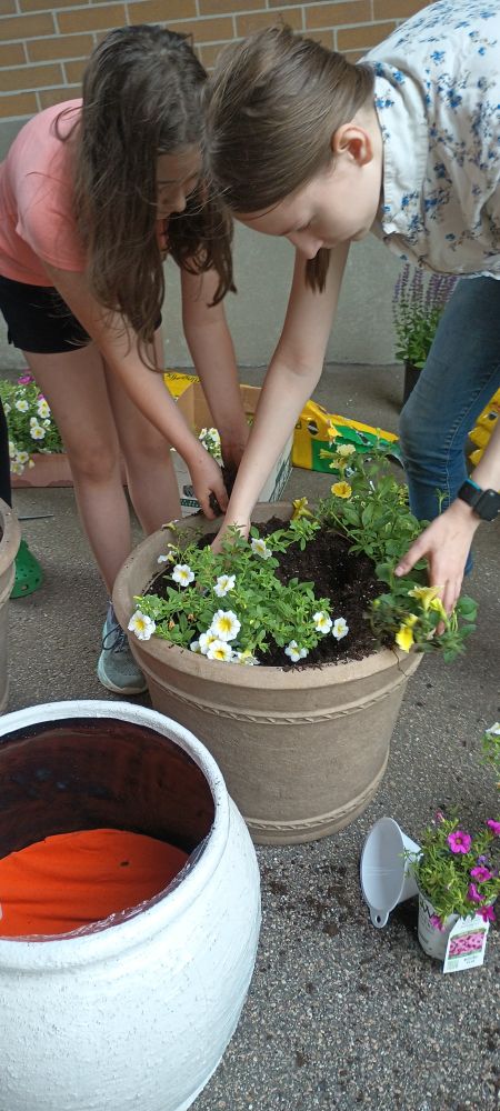 Volunteers planting at St. Agatha's in Woonsocket.