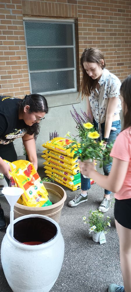 Volunteers planting at St. Agatha's in Woonsocket.