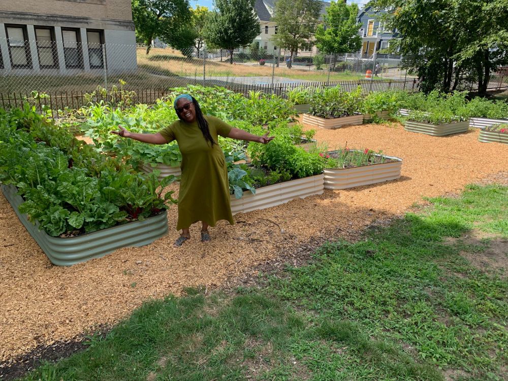 Michelle showing off beautiful vegetable gardens.