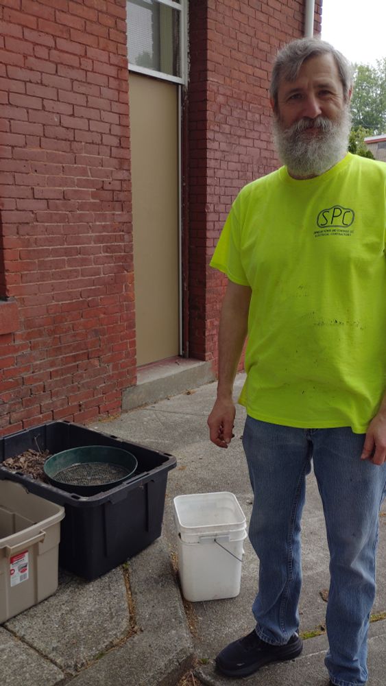 Volunteer helping to prepare for planting.