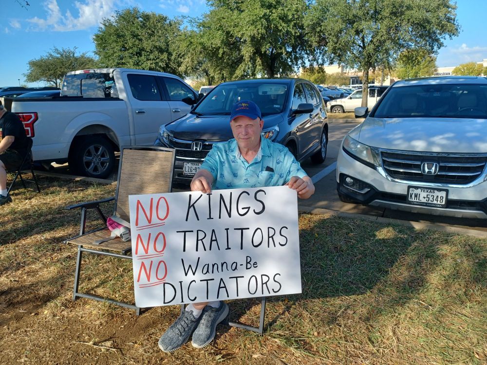 sign: No kings, no traitors, no wanna be dictators