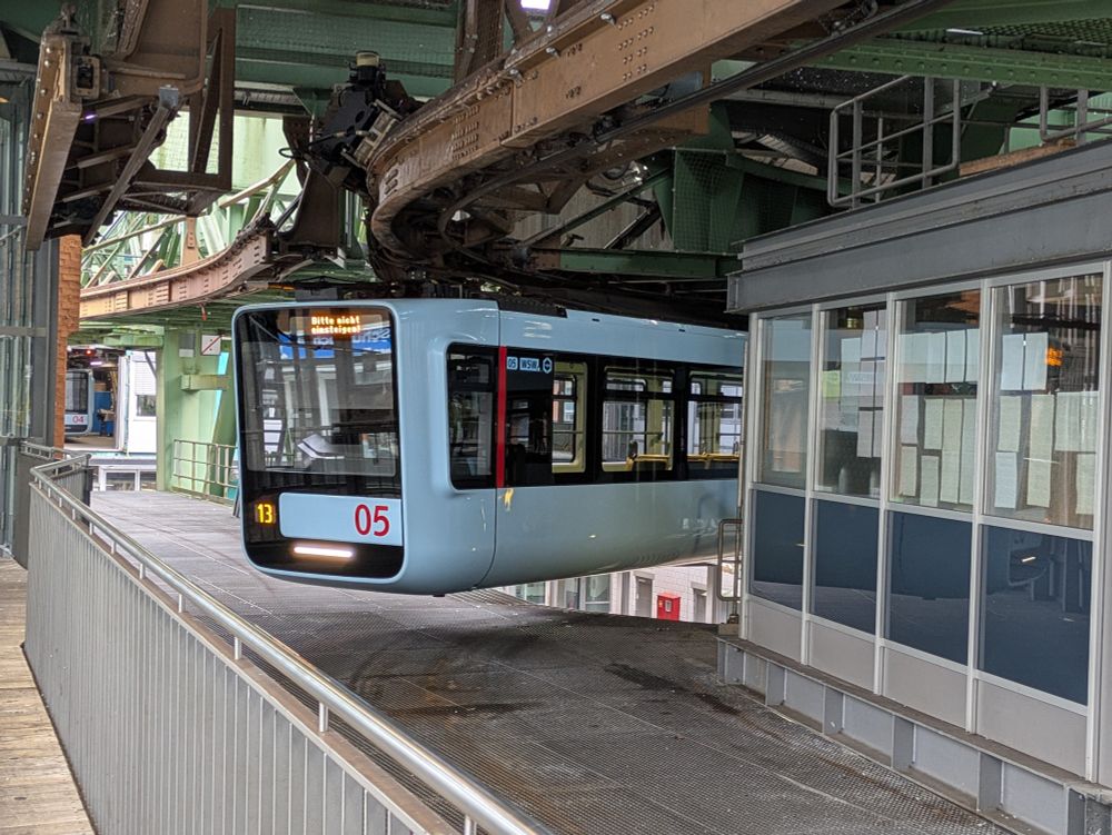 A Schwebebahn train rounding a corner 