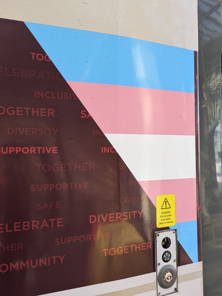 The transgender flag displayed on the side of a train 
