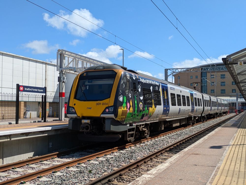A Bradford City of Culture branded Class 331 train at Bradford Forster Square train station 