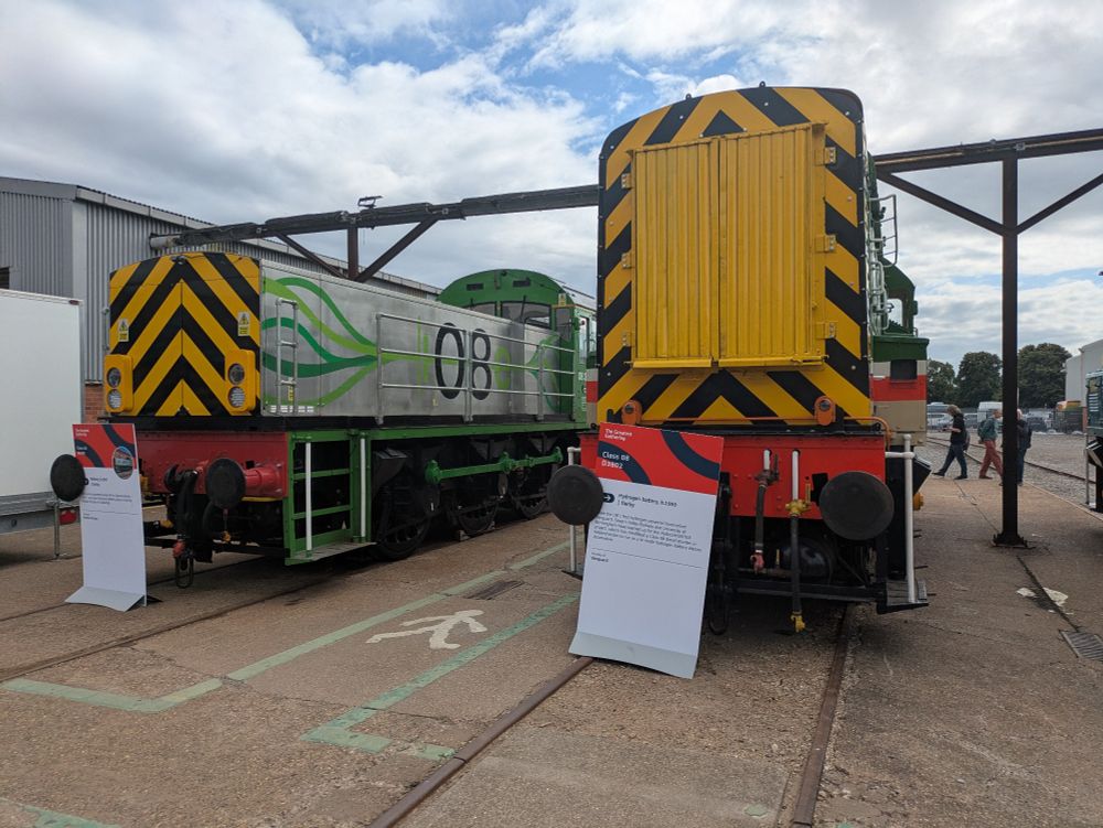 An electric Class 08e and a Class 08 trains in two sidings at Litchurch Lane