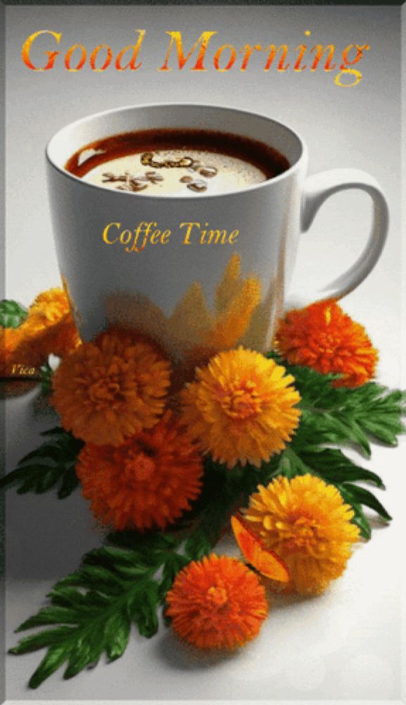 a cup of coffee is surrounded by flowers and says good morning