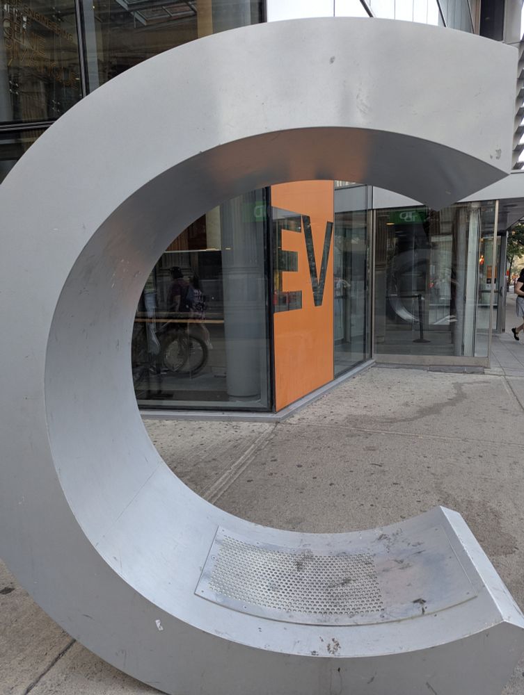 Metal sculpture of the letter C.