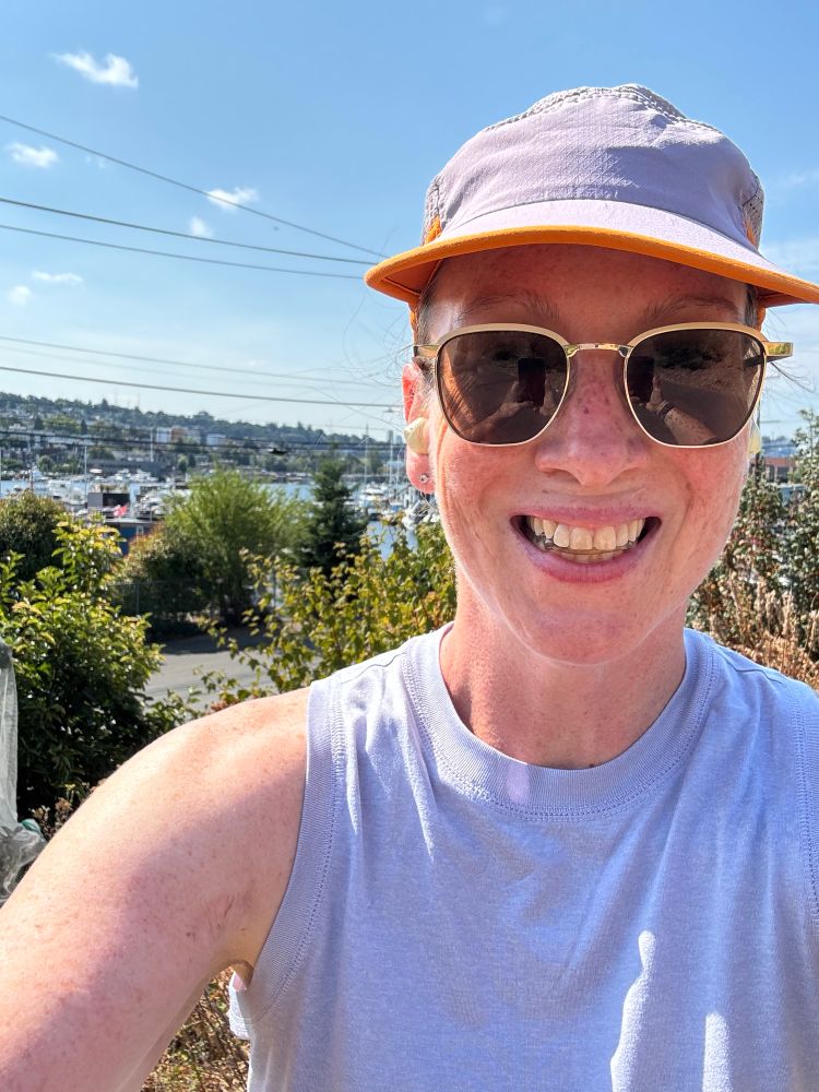Selfie by the timber new build office building next to the burke with gasworks park area and shoreline in the background and opposite shoreline. 