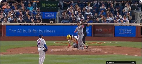 screengrab of a home run where the catcher is bent over in frustration afte the ball was hit about 899 feet