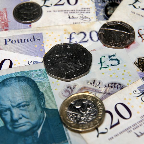 Photo of pound notes and coins.