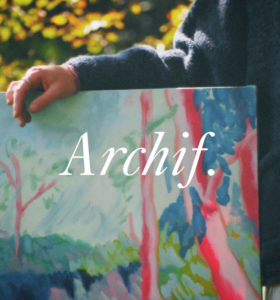 Photo of colourful painting of trees, with the word Archif in white text