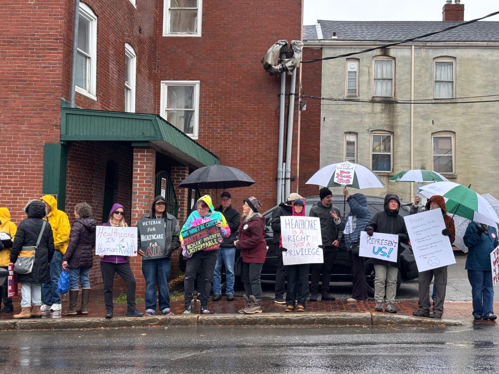 protestors outside Senator Angus King's office in Portland