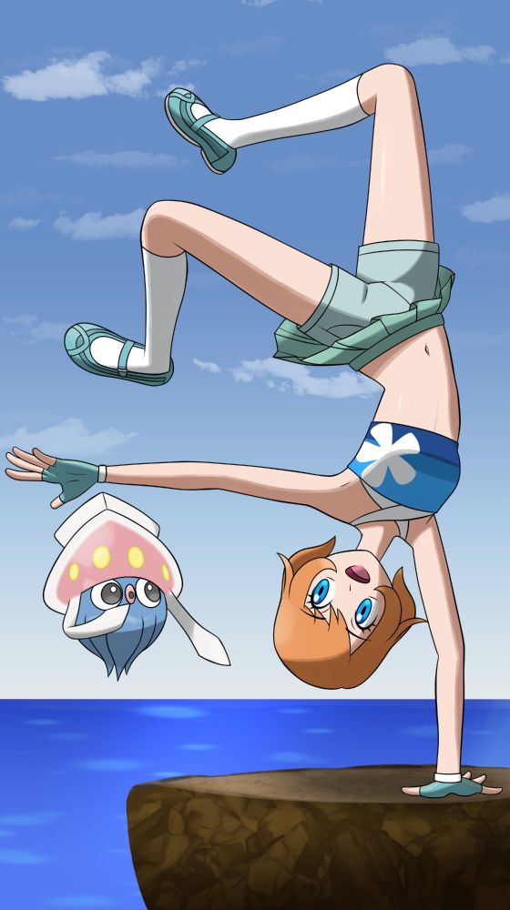 A wild Inkay amazed by a trainer's handstand over the cliffs of Route 8, Kalos.