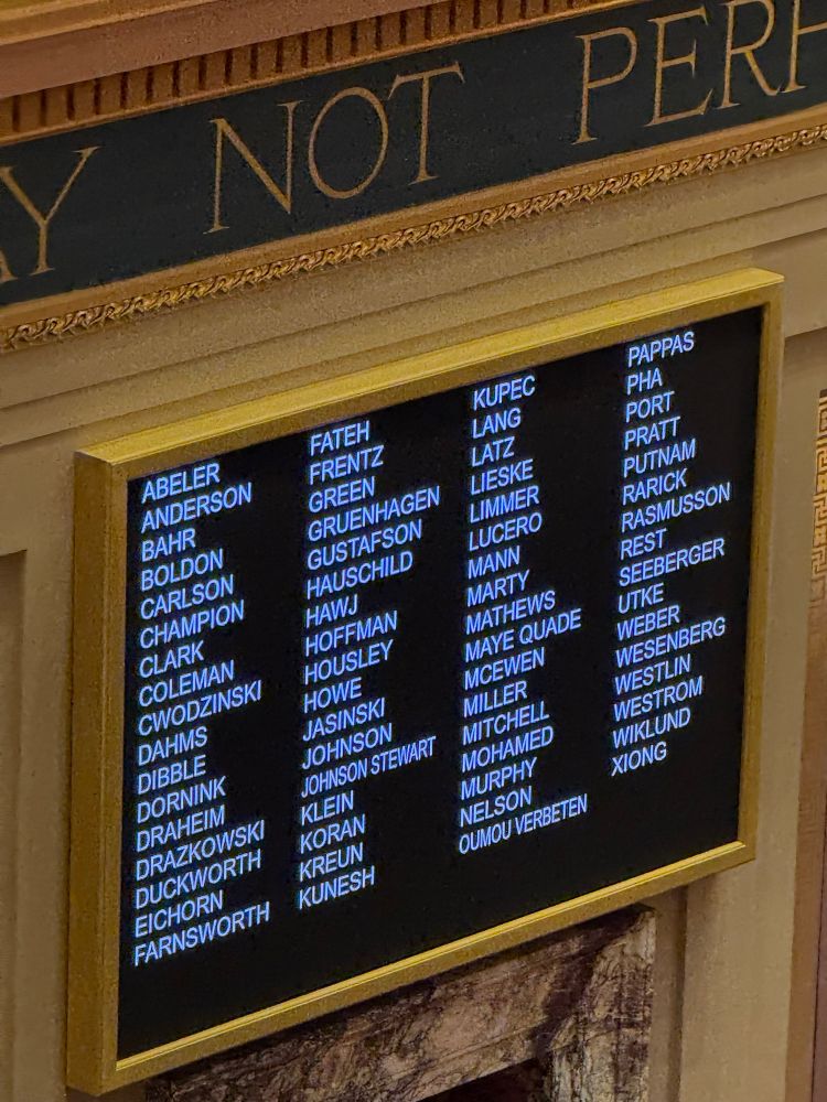 A digital board in the Minnesota Senate that is used to record roll call votes of Senators. The board shows newly sworn in Senator Doron Clark restoring the majority for the MN DFL. 