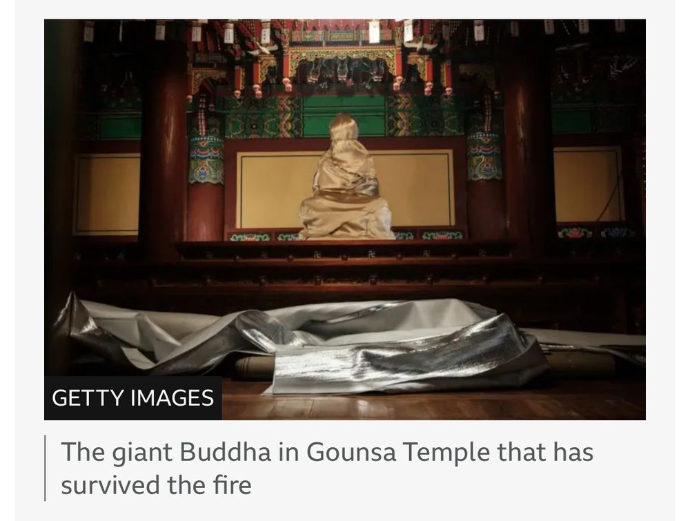 The giant Buddha in Gounsa Temple that has survived the fire.

GETTY IMAGES