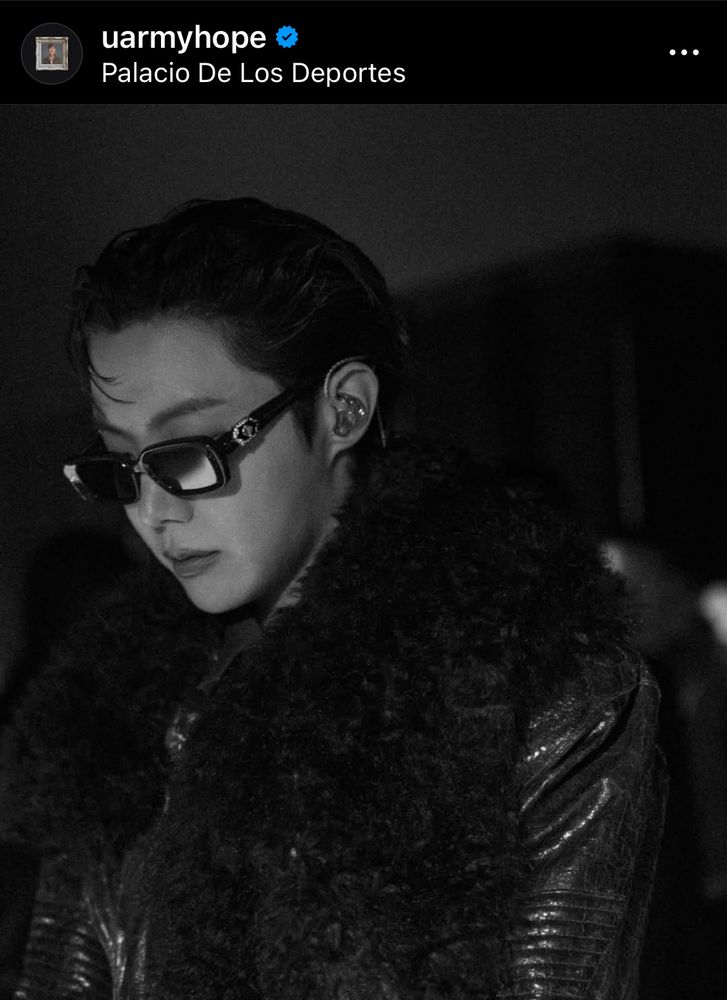 A black and white photo of an Asian man [J-Hope of BTS]