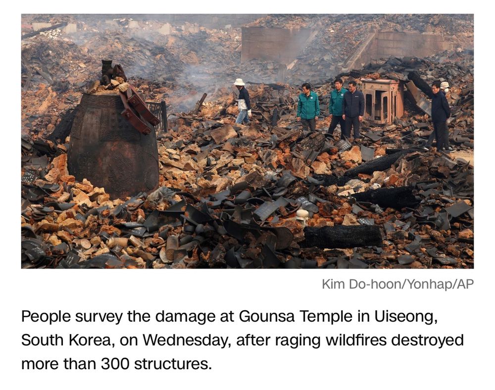 People survey the damage at Gounsa Temple in Uiseong, South Korea, on Wednesday, after raging wildfires destroyed more than 300 structures.

Kim Do-hoon/Yonhap/AP