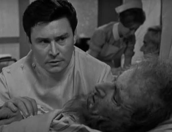 Close shot of Ronald Lewis as Dr Max Harris and John Gabriel as Smiffershon - a screencap from the 1965 Out of the Unknown episode ‘Some Lapse of Time’.