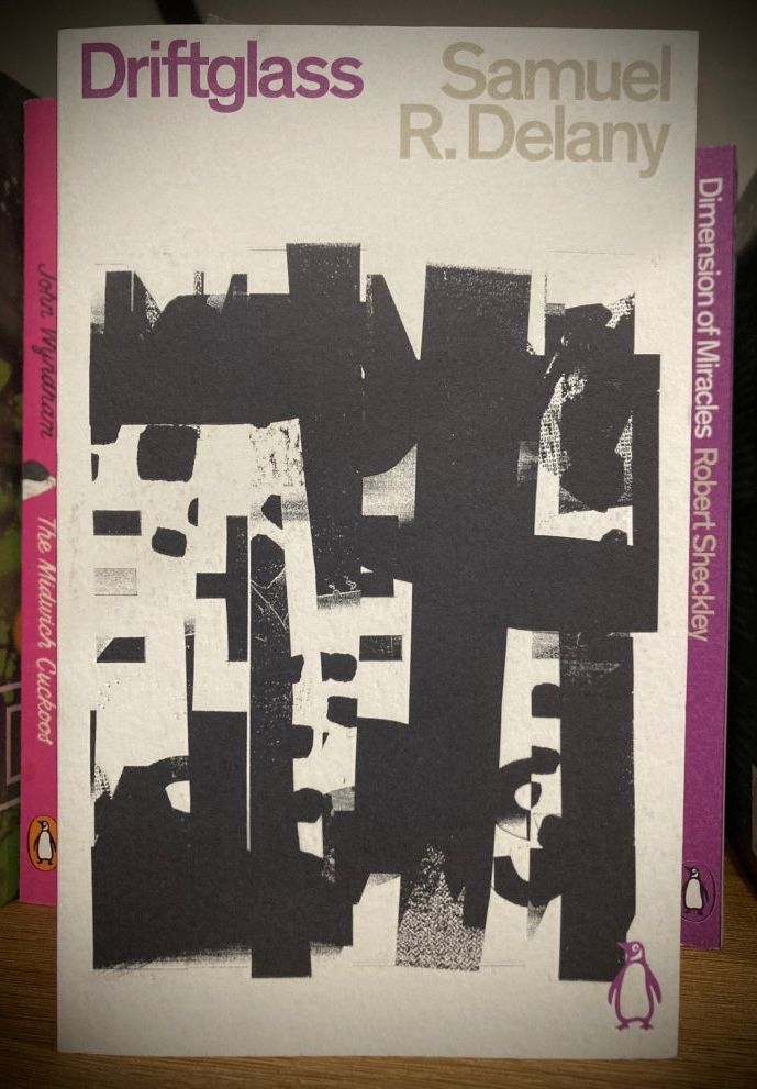 Cover of the Penguin edition of Samuel R. Delany’s 1971 collection ‘Driftglass’. Cover image composed of angular abstract shapes (black and grey formations on a white background).