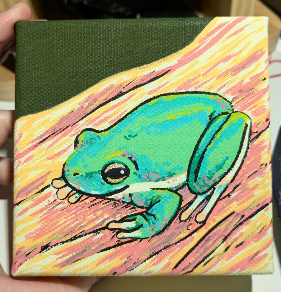 A small square canvas painted with posca markers. It depicts a glistening frog resting on a branch. 