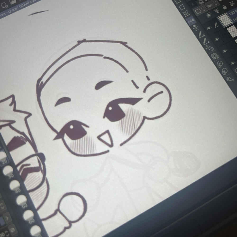 Lineart over previous sketch - one if the figure's heads without hair