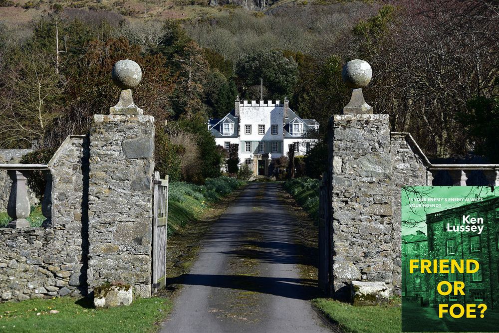 This modern image shows Lochryan House in Cairnryan. A pair of gateposts topped off by stone balls dominate the centre of the frame, with lower walls either side of them. Between the gateposts, a drive leads from the foot of the frame into its centre, where part of a three-storey white mansion can be seen, topped off by crenellations. There are trees and bushes either side of the drive and beyond the mansion a wooded hillside leads out of the top of the frame. The scene is in sunlight. The front cover of ‘Friend or Foe?’ is shown in the bottom right corner.