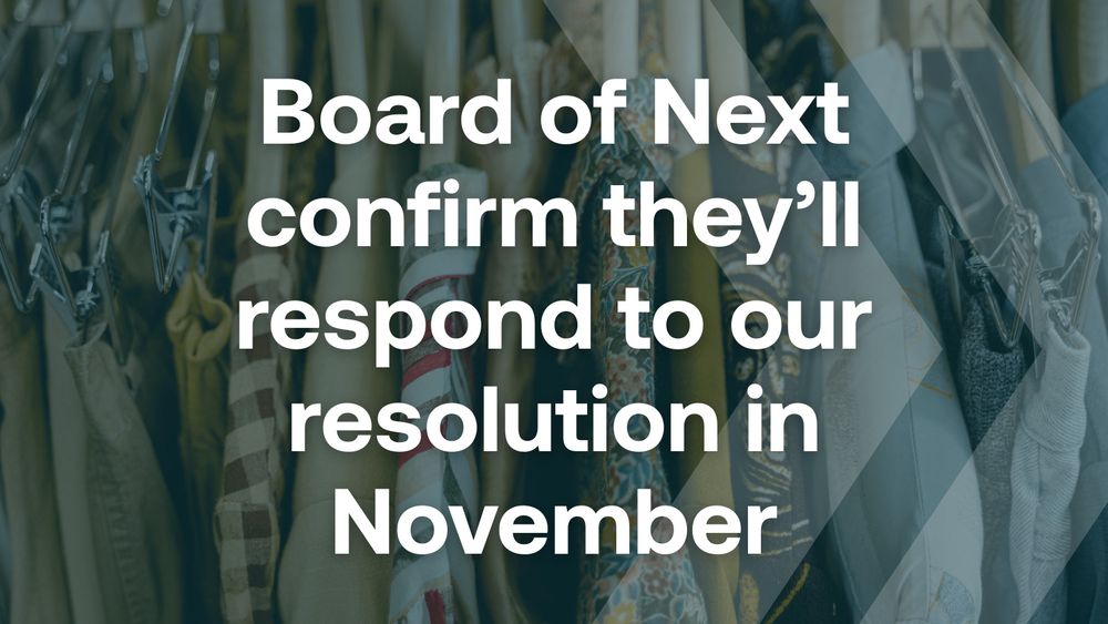 An image of a rail of clothes on hangers, with text overlaying that reads "Board of Next confirm they'll respond to our resolution in November"