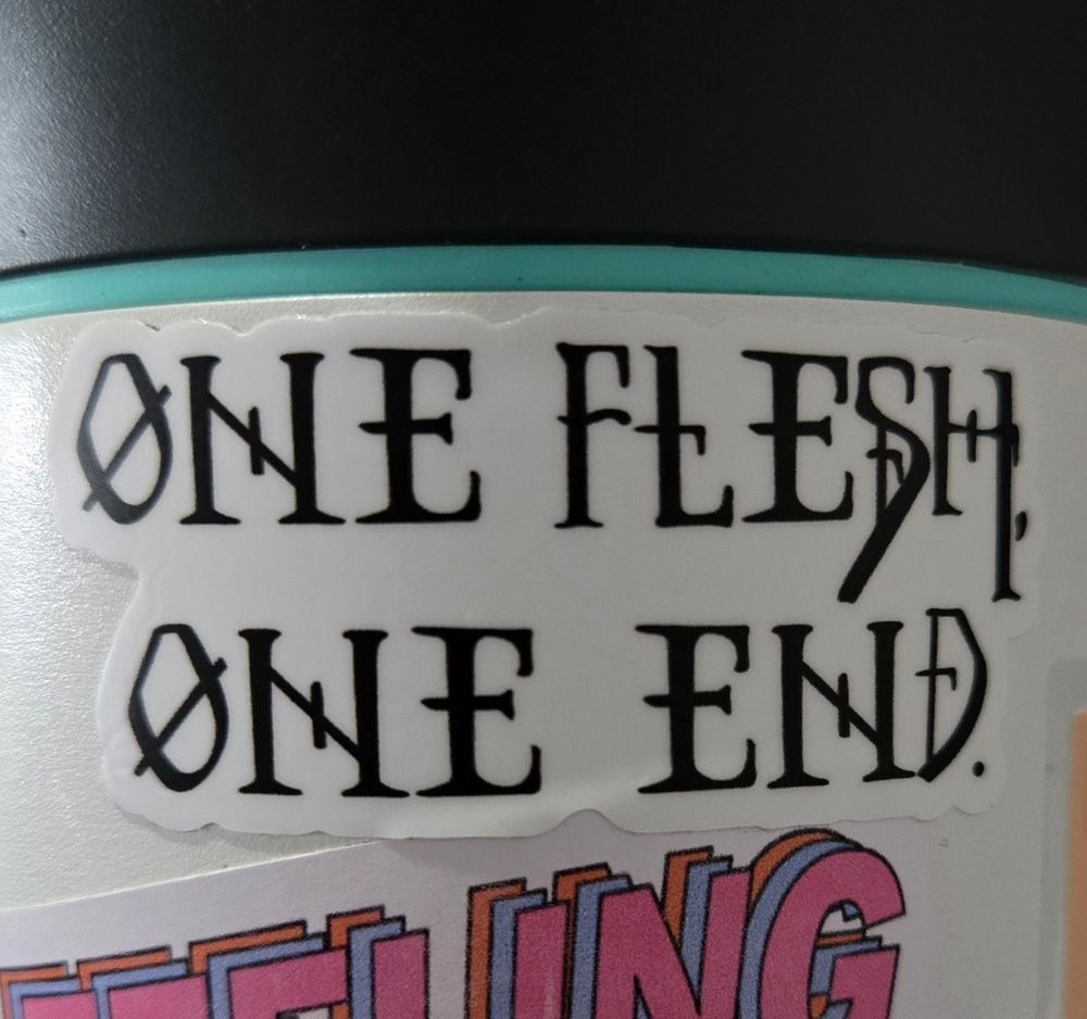 a Gideon the Ninth sticker of the quote "One flesh, one end."