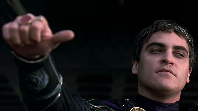 Emperor from Gladiator movie with thumbs to side.