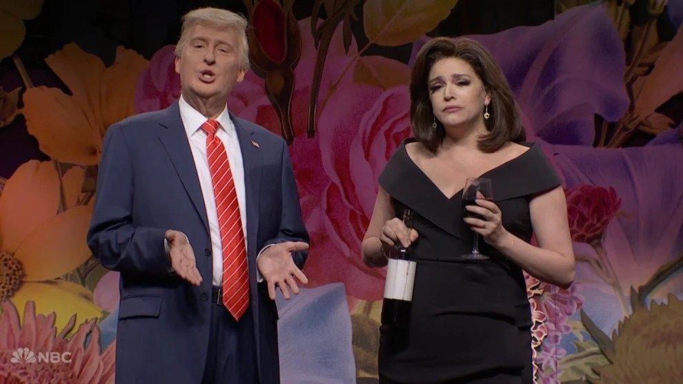 Cecily Strong as Janine Pirro holding a bottle of wine and glass of wine next to James Austin Johnson playing Trump. 