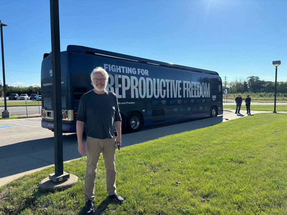 Yours truly standing in front of a Reproductive Freedom Tour Bus in Pewaukee, Wisconsin in September  prior to canvassing for Dems. 
