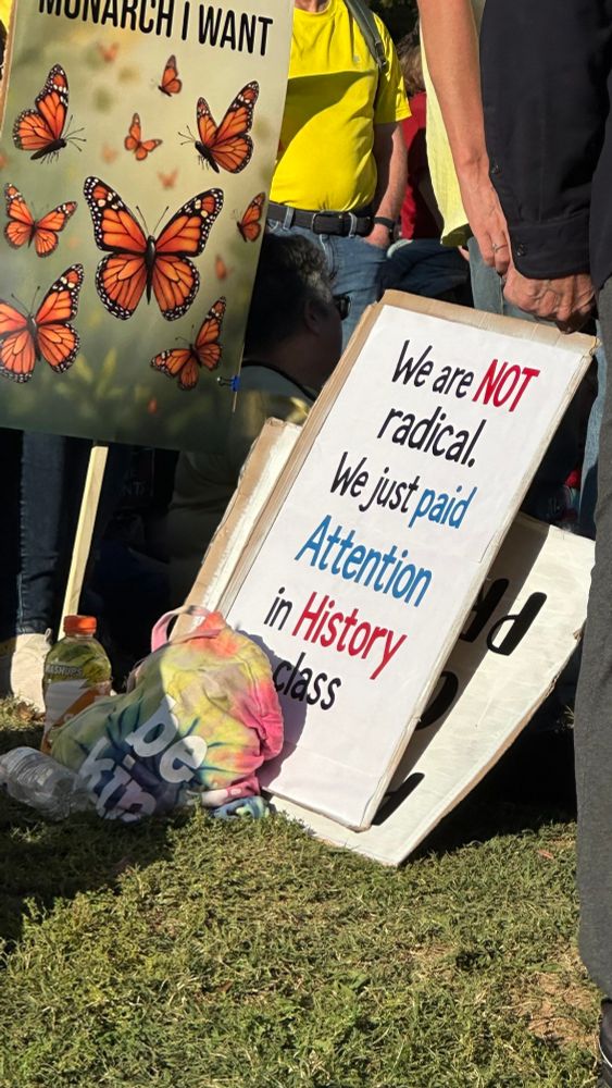 Protest sign says, "we are not radical. We just paid attention in history class."