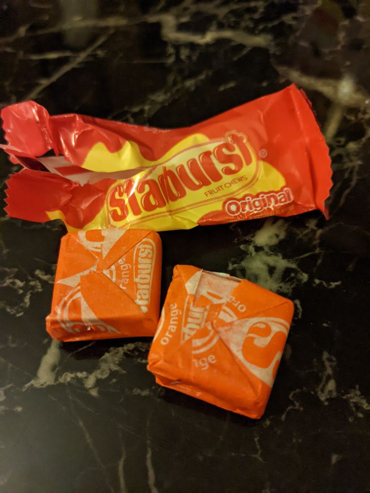 A two pack of Starburst with two orange pieces.