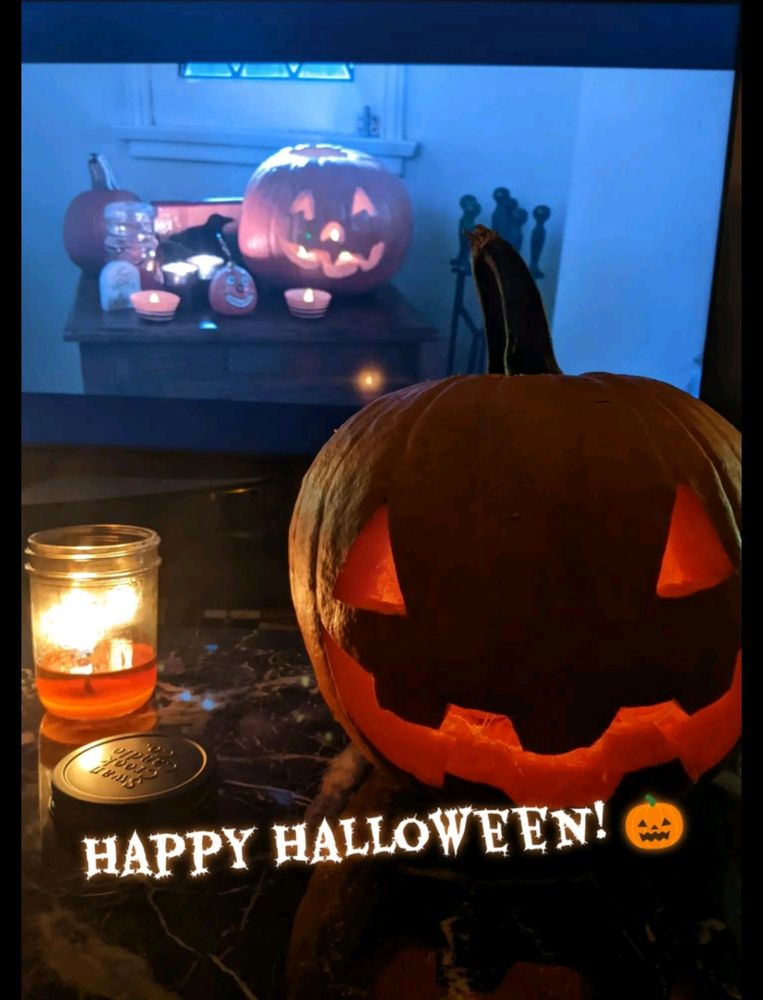 A picture of a jack-o'-lantern and a candle with text that says "Happy Halloween! 🎃"