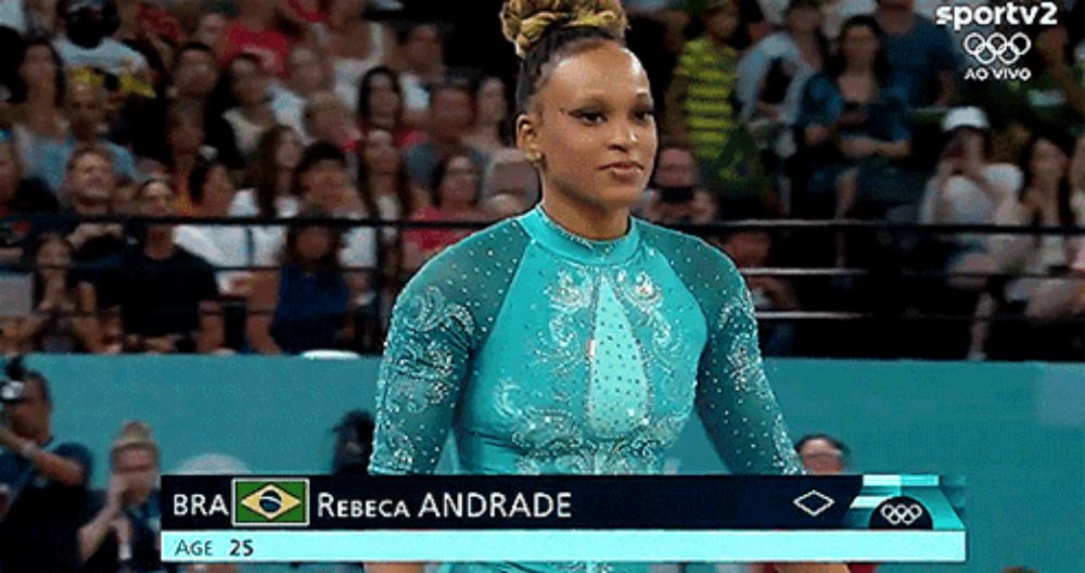 a gymnast named rebeca andrade is standing in front of the crowd