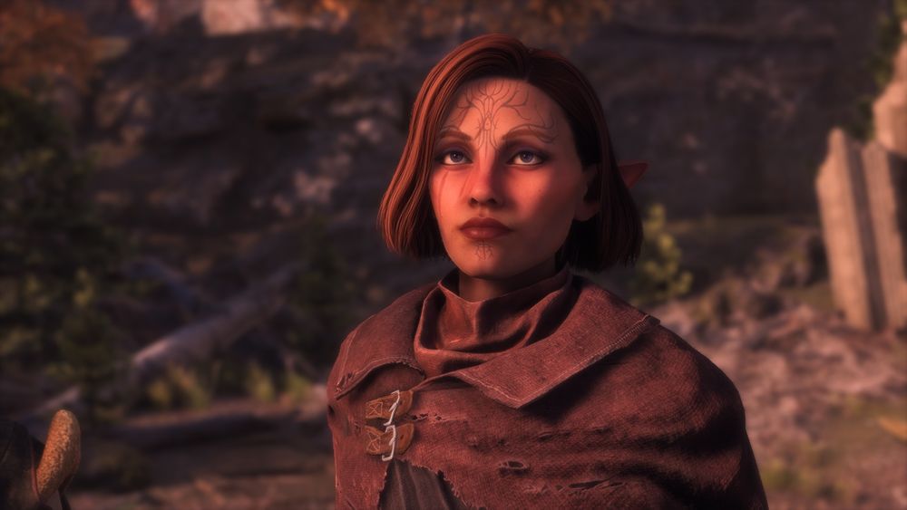 Ayla “Rook” Thorne, an elf with light  blue Dirthamen valleslin on her forhead, three scars across her right eye, purple doe eyes, and a reddish brown bob.