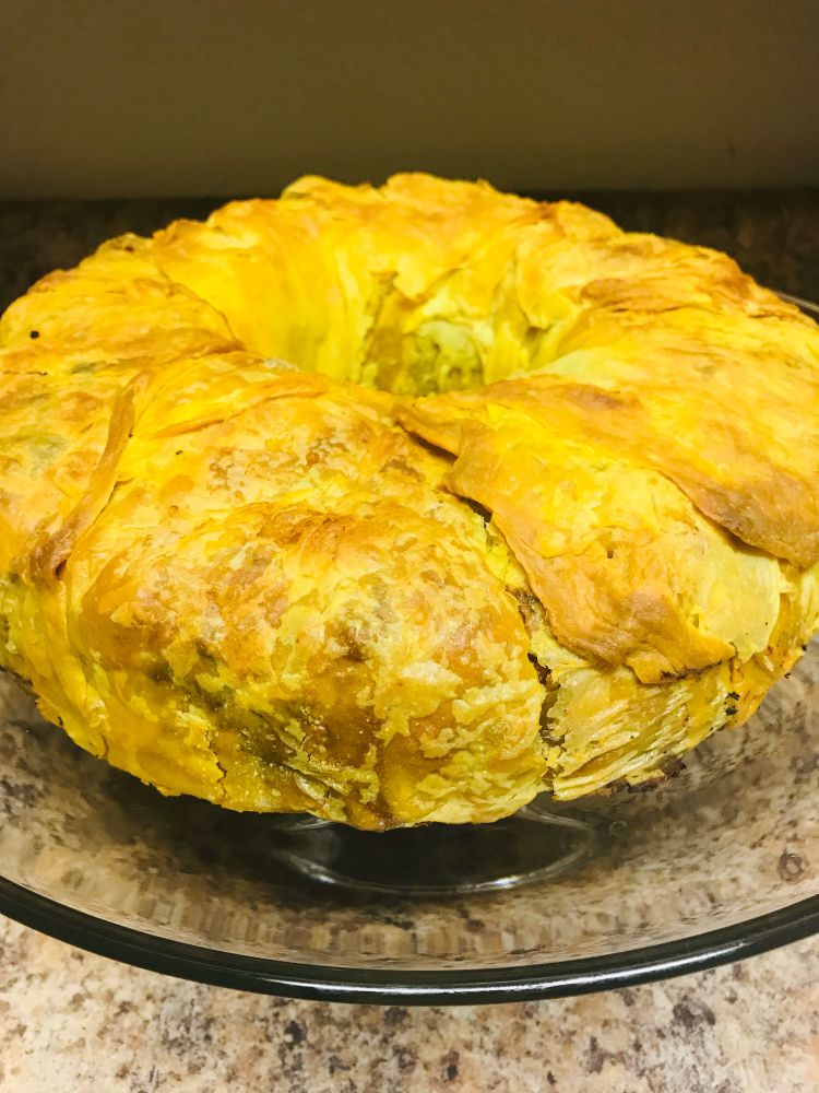 A photo of a ring of golden phyllo dough which has been made into a pie